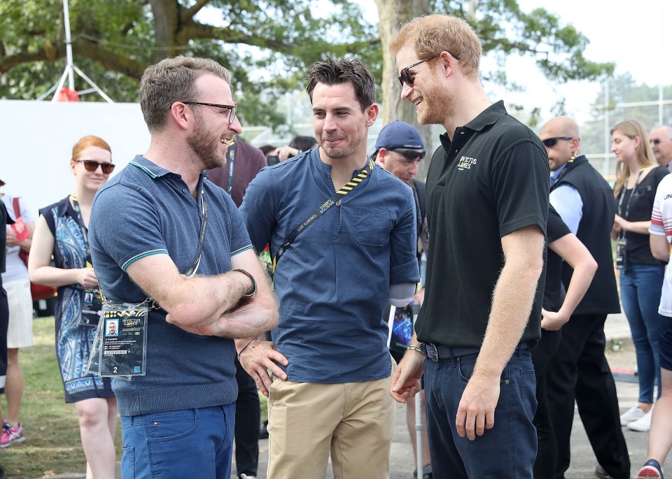 Prince Harry speaks with JJ Chalmers (left) and Jaco van Gass at the 2017 Invictus Games in Toronto, Canada