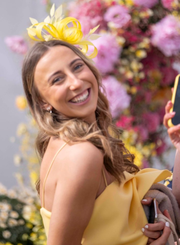 This lady looked lovely in a shade of yellow which she matched with a fascinator in the same colour