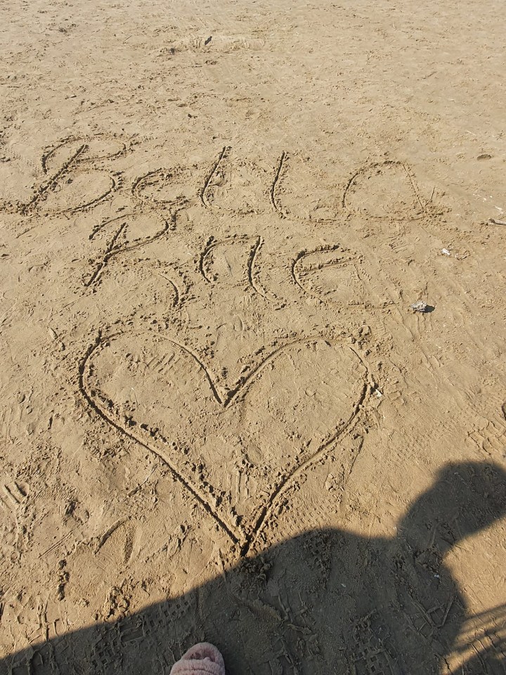 A tribute in the sand to the killed one-year-old