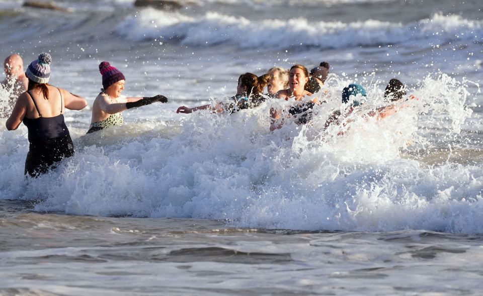 Bobble hats make up the swimwear for these brave swimmers in Tynemouth