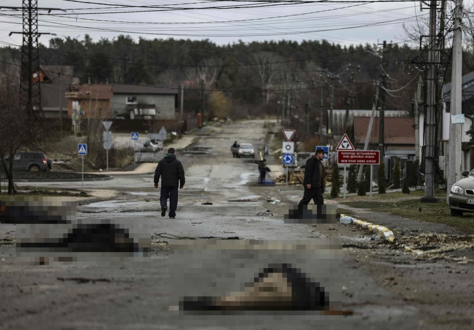 Bodies pictured on a street in Bucha, as the UK investigates war crimes