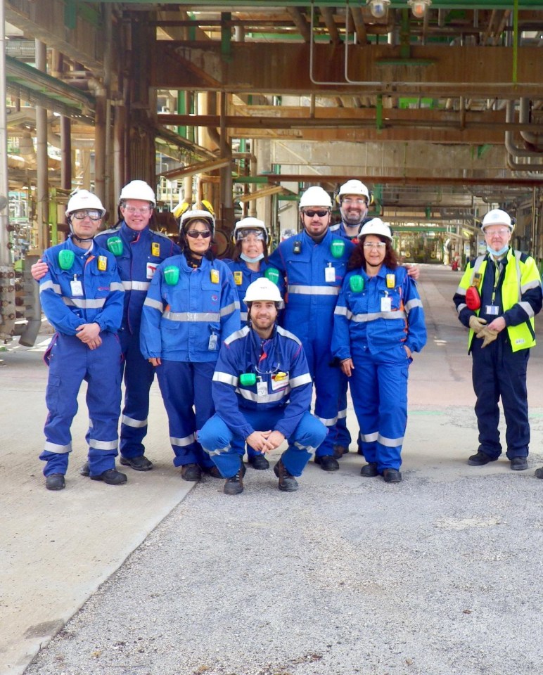 Flamini posed in work gear with some other colleagues