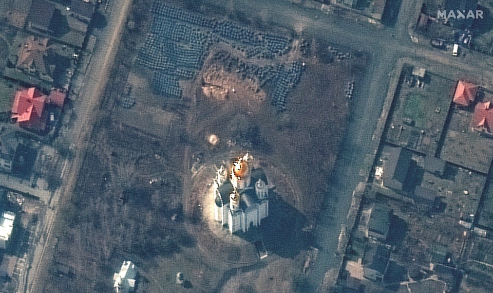 A satellite image shows a mass grave site near the Church of St. Andrew and Pyervozvannoho All Saints in Bucha. The trend is around 45ft long