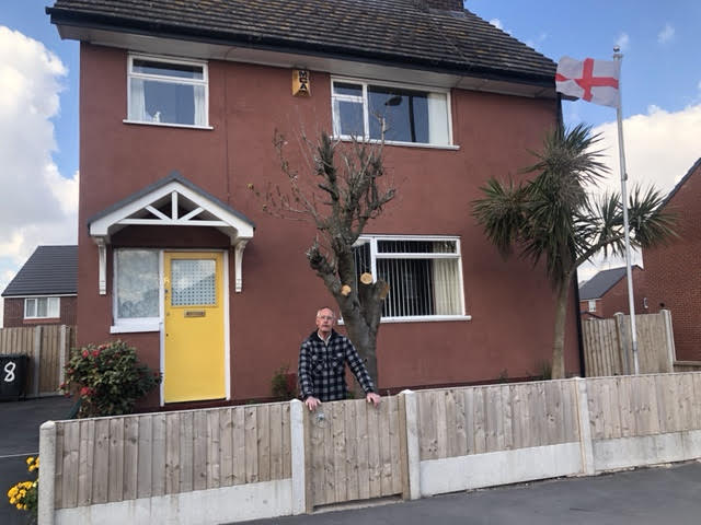 Charlie still has the bright yellow front door on his four-bed property