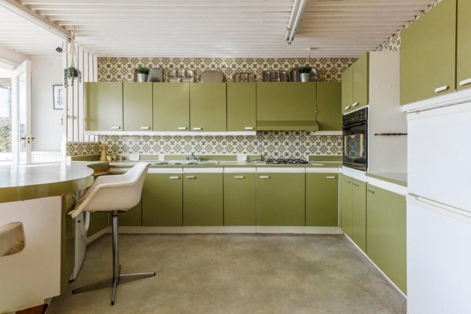 The property is well known for its kitchen, which is painted olive-green