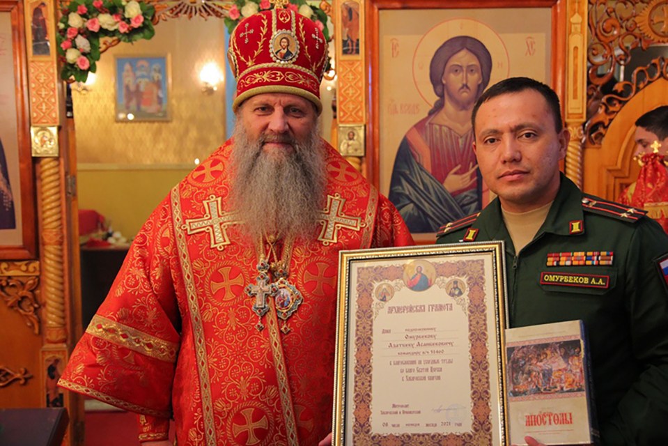 Lieutenant Colonel Azatbek Omurbekov was blessed by an Orthodox priest in November