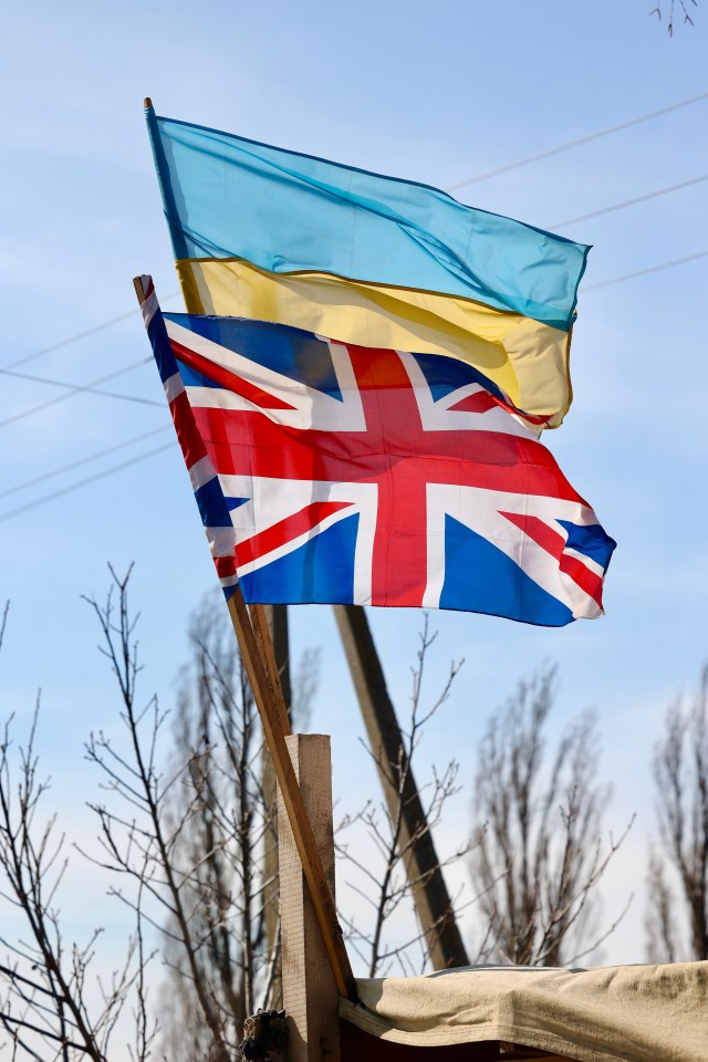 Volunteers flew the Union Jack as the UK pledged cash, arms and sanctions to ensure that 'Putin must fail'