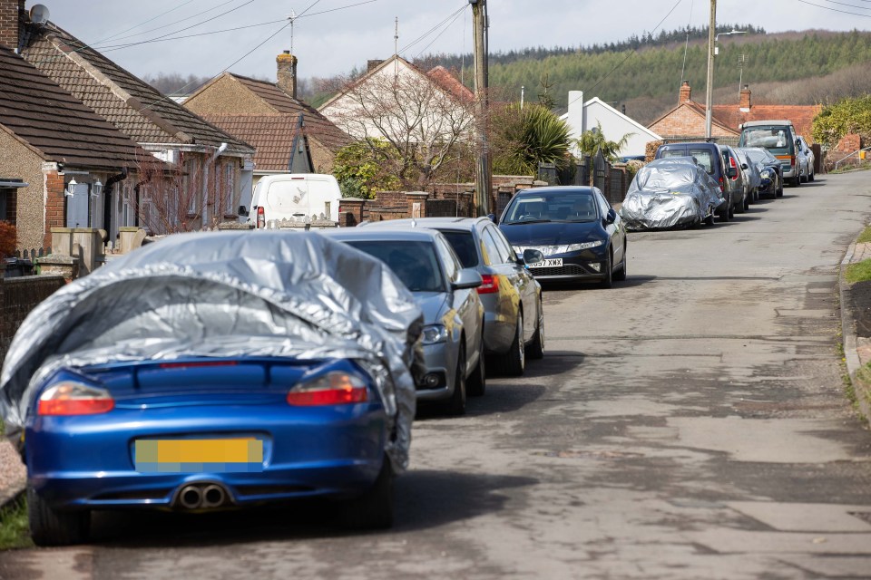 Locals say they're having difficulty accessing their drives because of the way Graham Wildin has parked his vehicles. Mr Wildin's cars are covered with silver sheets to protect the bodywork