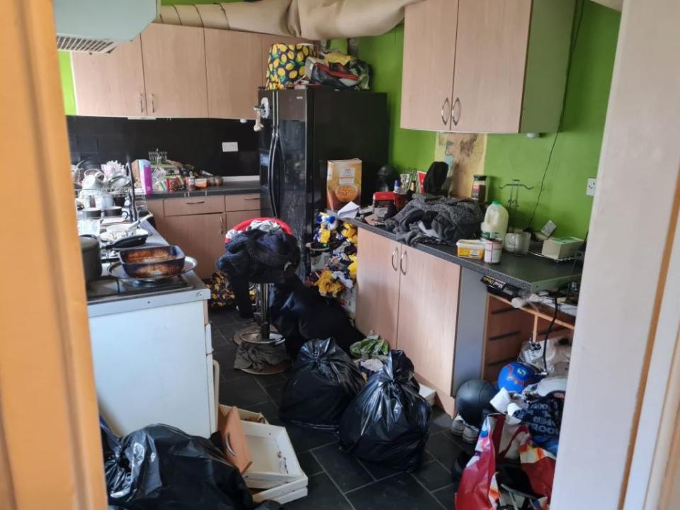 The end-of-terrace house in Rotherham, South Yorkshire, is piled high with rubbish