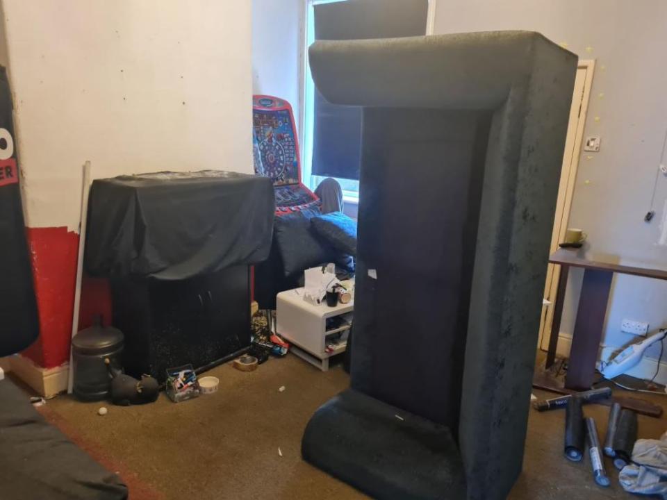 Another image shows a sofa tipped on its side next to what appears to be an old-school arcade game