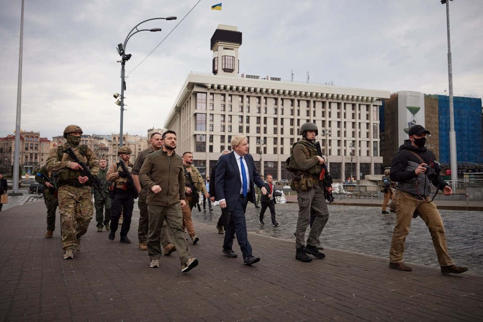 Johnson and Zelensky were flanked by armed soldiers as they walked through Kyiv