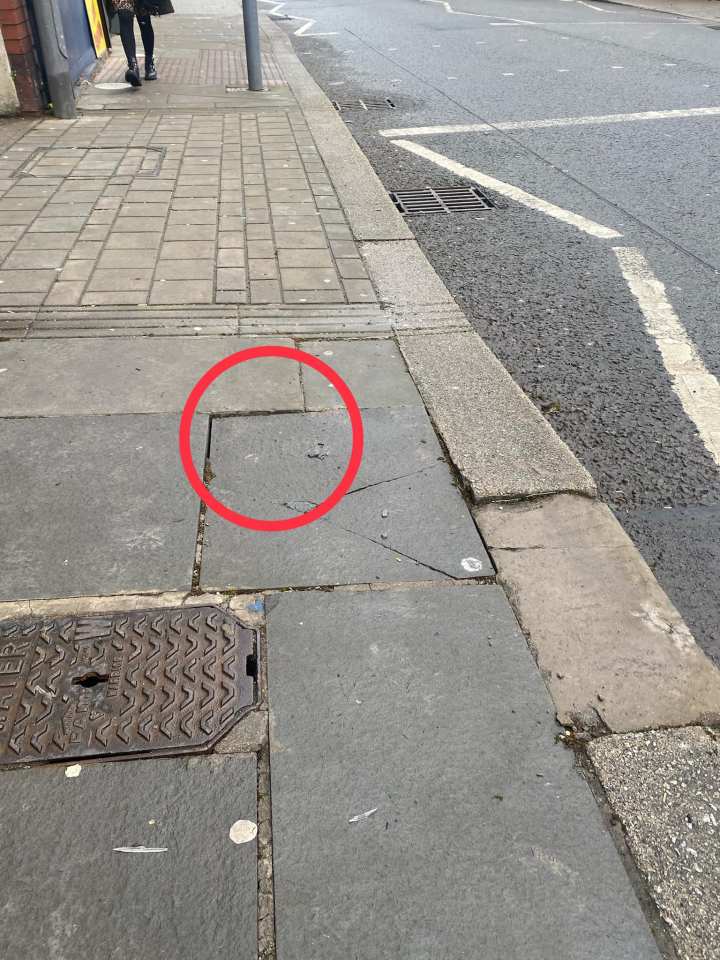 The loose paving slab Debbie fell over in Maesteg in Bridgend, south Wales