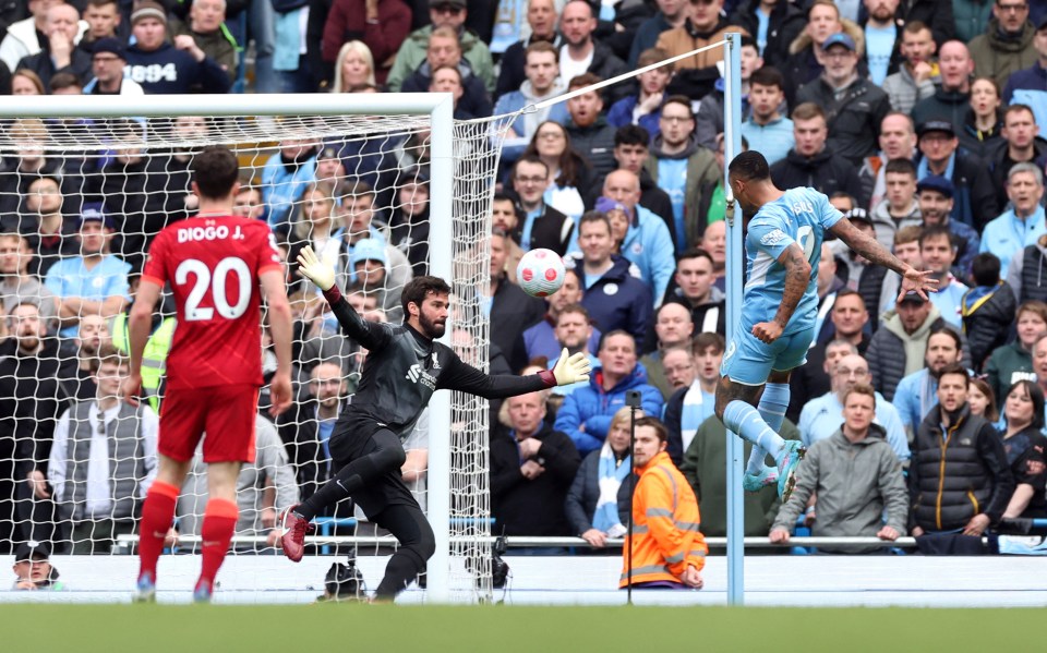 Gabriel Jesus kept his cool and jumped to side-foot past Alisson off the bar