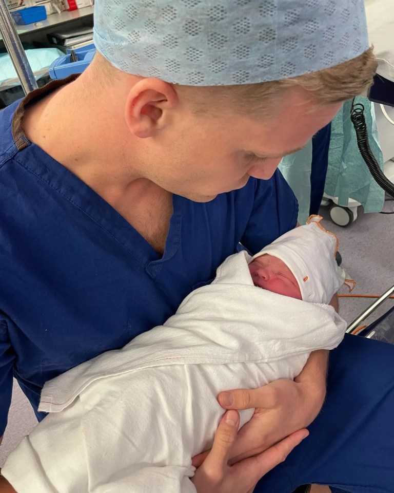 The Everton loanee holds baby Lomee