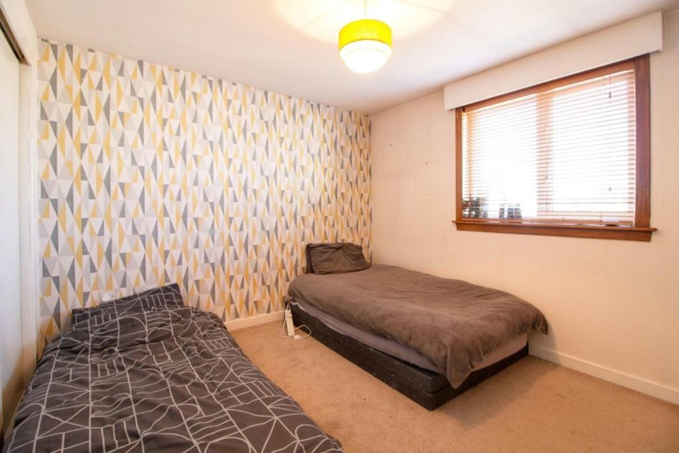 A light and spacious bedroom in the former police station