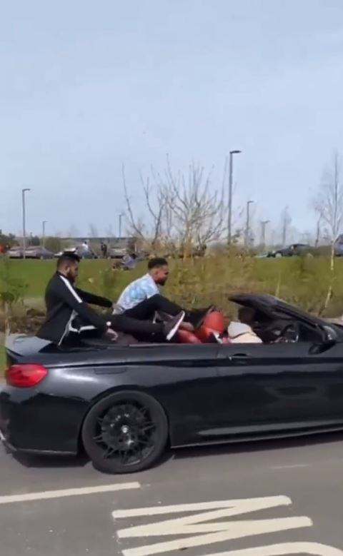 The man desperately tried to cling onto the car as his pal accelerated