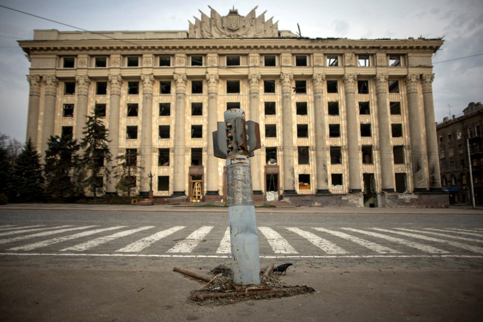 A Russian shell is embedded in a Kharkiv road