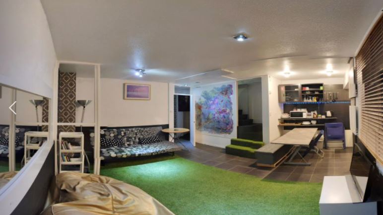 The home has been fitted with astroturf rather than carpet, with the artificial grass creeping into every room but one