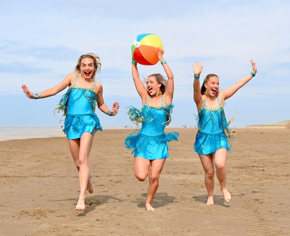 Showgirls Jen Moore, Becky Firth, and Paige Salanki make the most of the heat in Blackpool