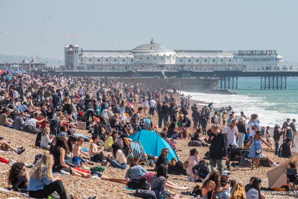 Sunseekers packed out Brighton beach as the mercury hit 22C on Saturday