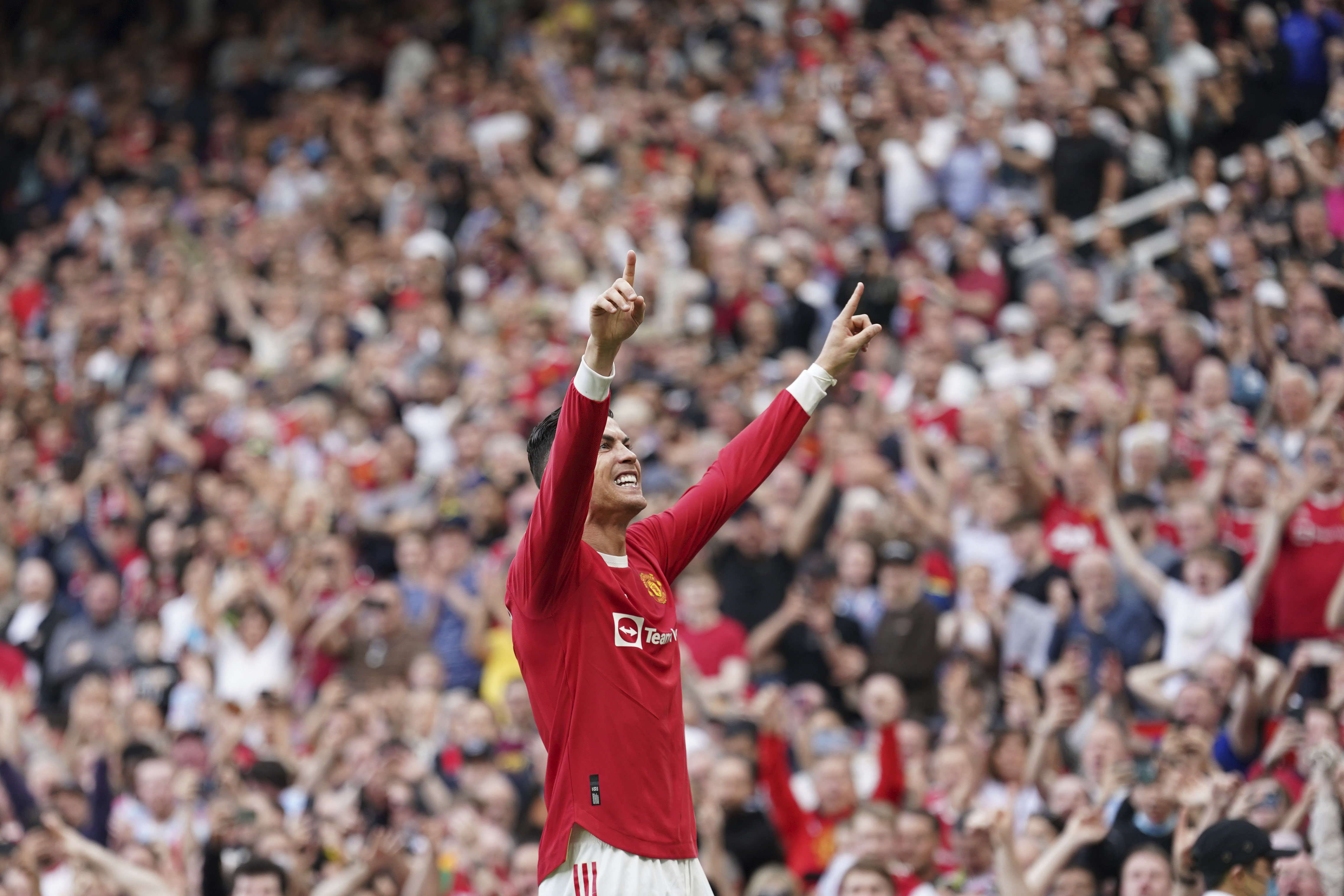 Manchester Unitedâs Cristiano Ronaldo celebrates after scoring his third goal during the English Premier League soccer match between Manchester United and Norwich City at Old Trafford stadium in Manchester, England, Saturday, April 16, 2022. (AP Photo/Jon Super)