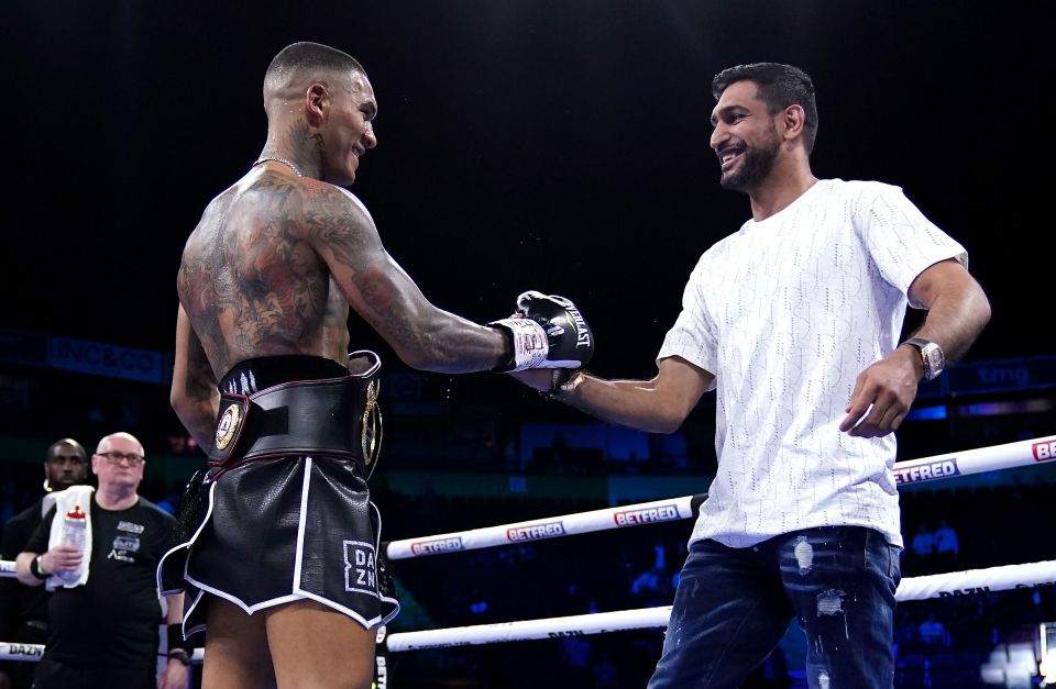 Conor Benn (left) is congratulated by Amir Khan after knocking out Chris van Heerden