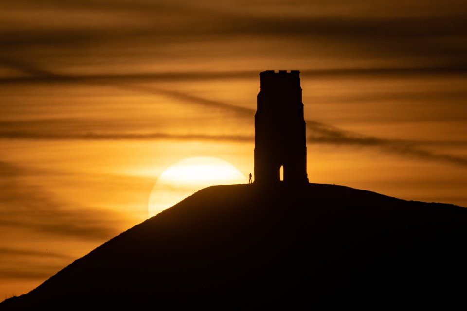 A spectacular sunrise over Glastonbury Tor, Somerset