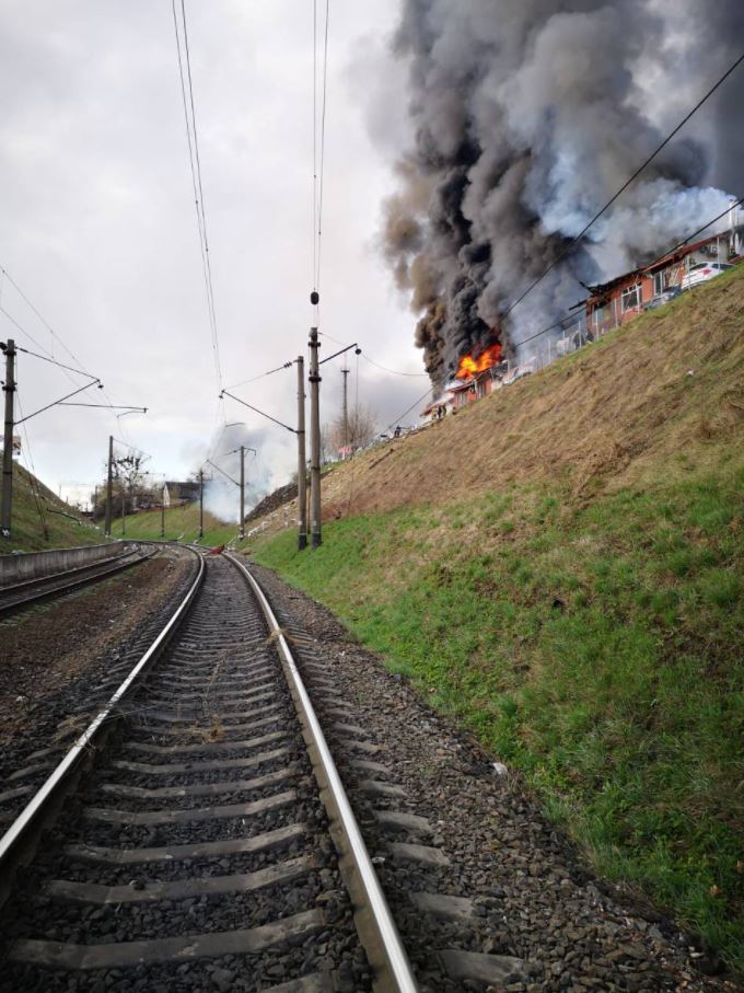 Fire and smoke seen from a train track in Lviv