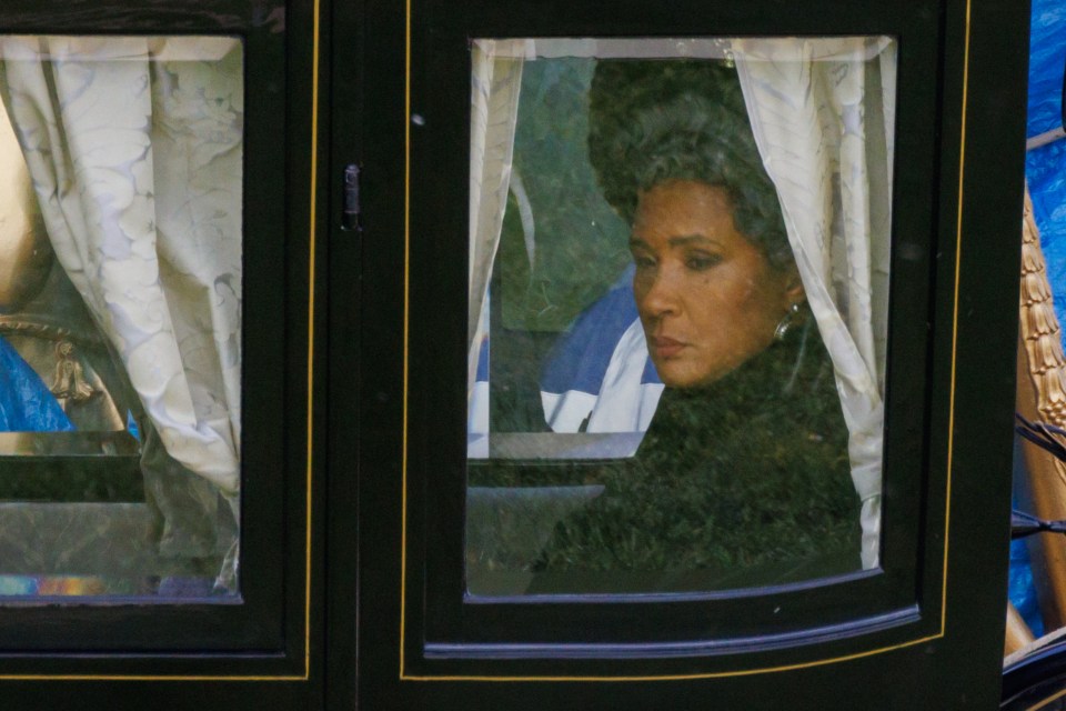 Queen Charlotte, played by Golda Rosheuvel,  is seen in deep mourning