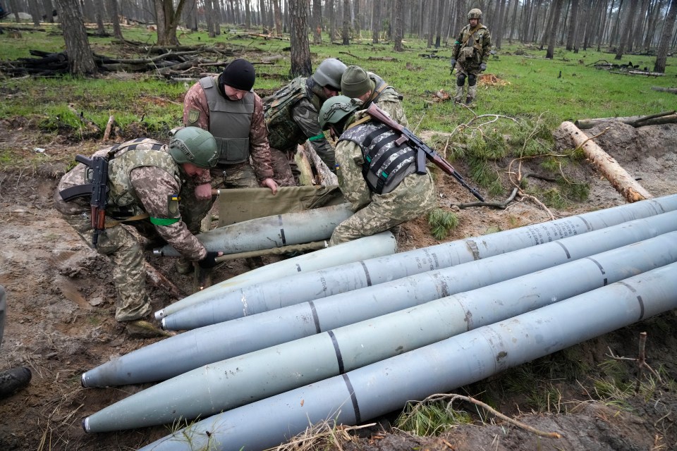 Ukrainian soldiers collect multiple Russian ‘Uragan’ missiles in the village of Berezivka, Ukraine