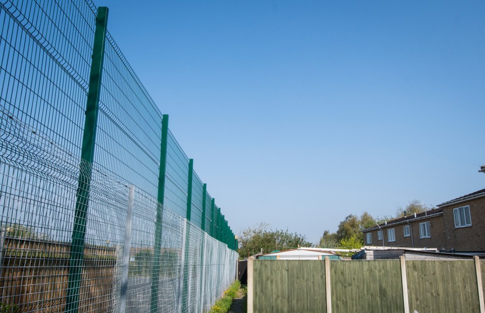 Residents want the fence to be torn down and replaced with a 2.1 metre high one instead