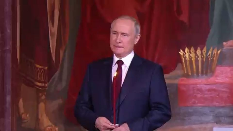 Gurning Putin seen biting his lips at midnight mass in Moscow