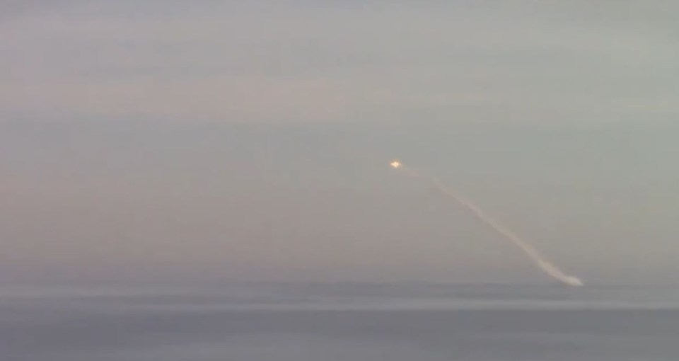 A Kalibr cruise missile streaks into the sky after being launched from under the Black Sea