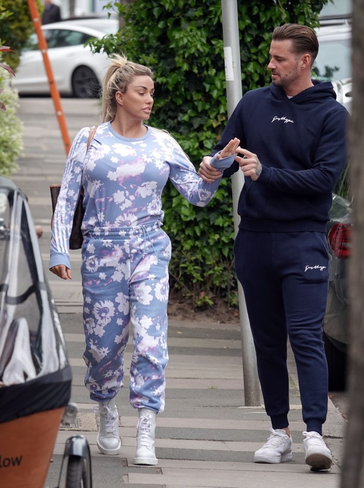 Katie Price and Carl Woods walked down the street in London