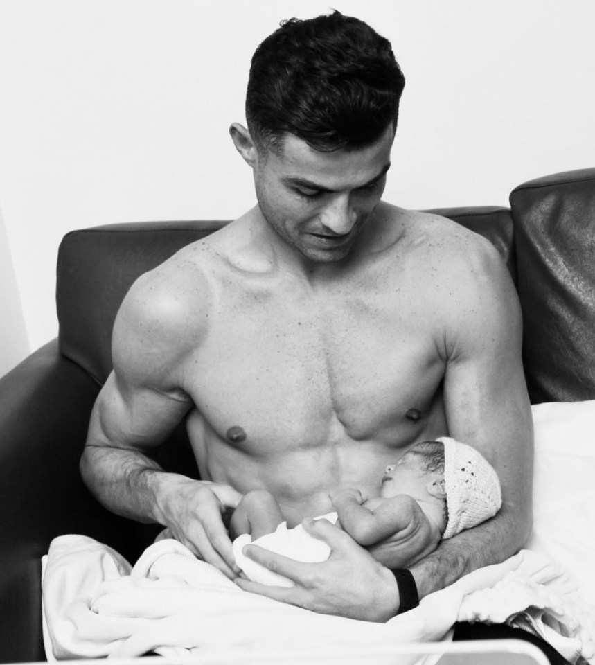 Cristiano Ronaldo cradles his newborn daughter