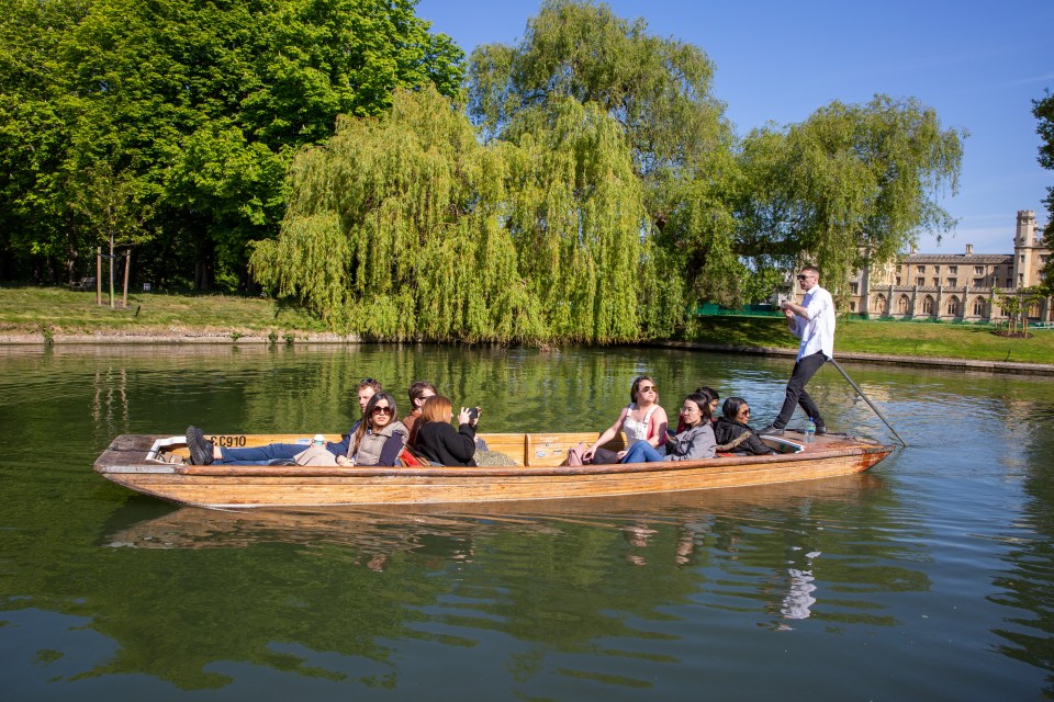 Brits soaked in the sunshie while out punting on the River Cam