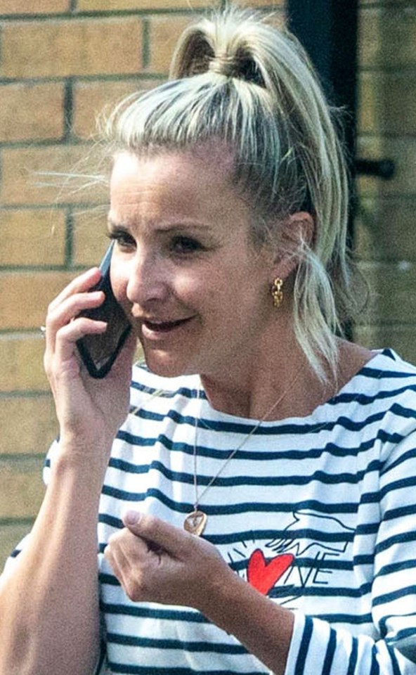 She was pictured making a phone call near the Leeds home they once shared