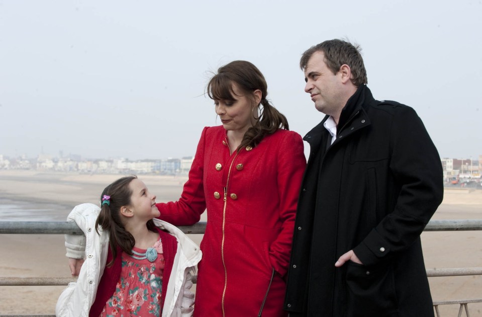 Elle with on-screen parents Simon Gregson and Kate Ford in 2011