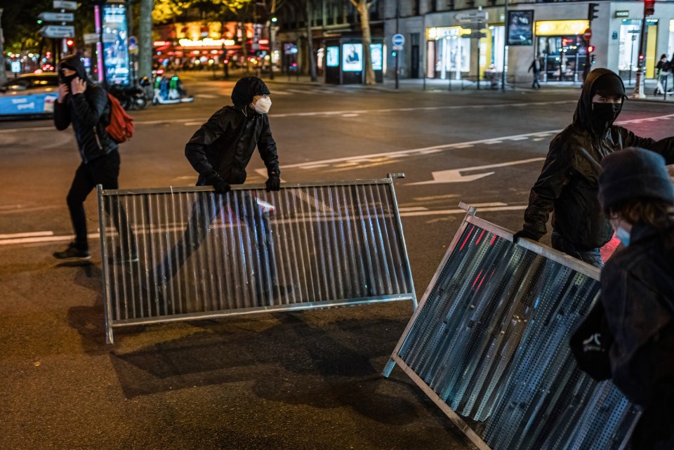 Masked figures filled the streets of the French capital after the result was announced