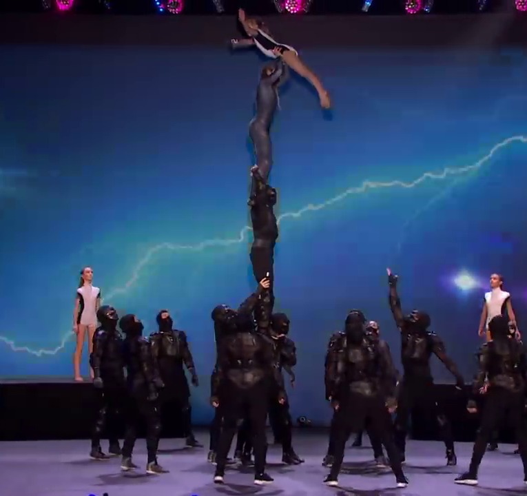 The Freaks are shown throwing a girl to the top of a human tower