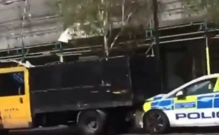 The lorry was filmed reversing at speed towards a police car in Stockwell, South London