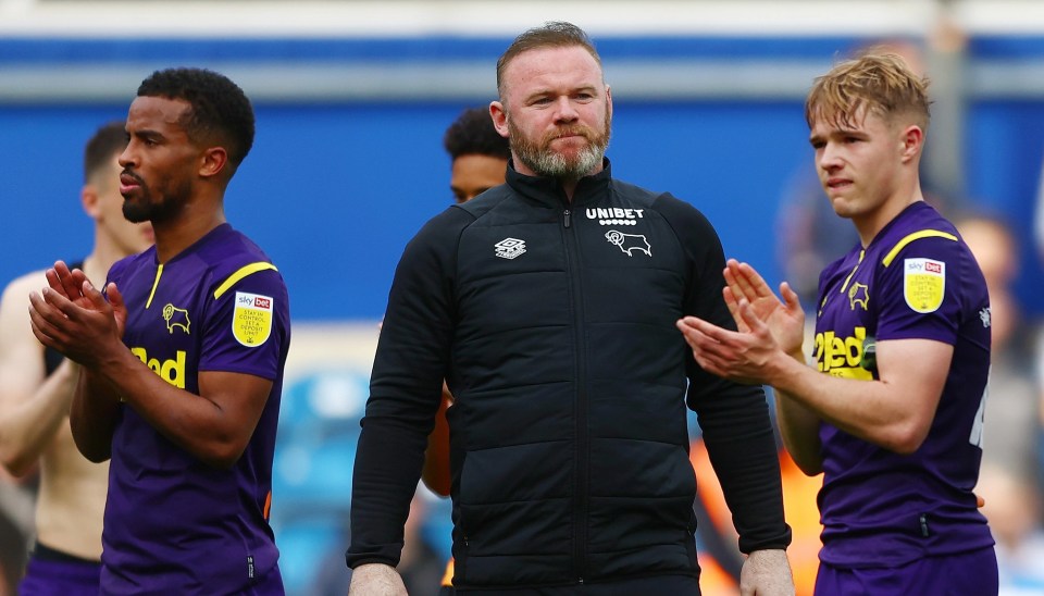 Wayne Rooney with Derby players after relegation was confirmed