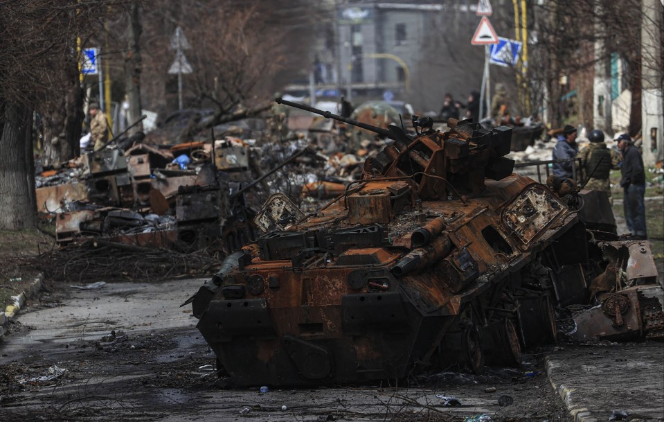 The remains of Russian military vehicles burned out on the road to Bucha