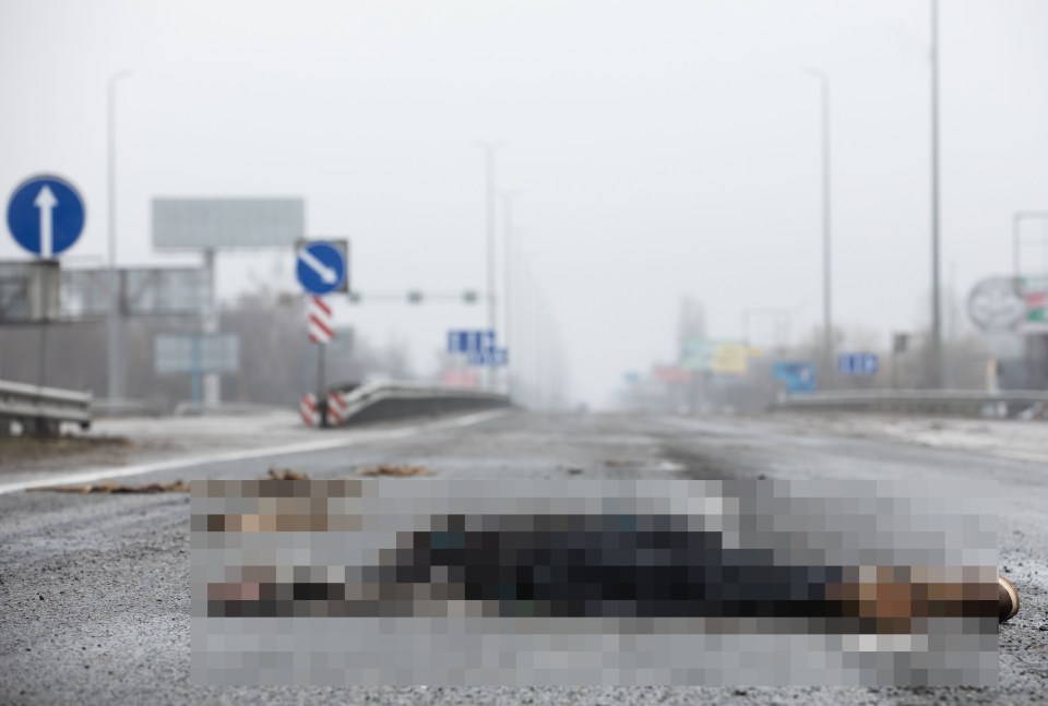 A dead civilian can be seen on a highway 12 miles from Kyiv