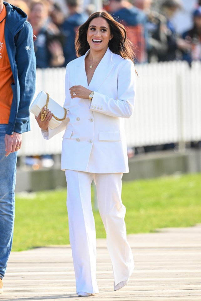 Also on display was a £286 Sophie Lis gold pendant necklace, the £12,626 diamond Cartier earrings she wore for her wedding to Harry, a gold chain finger bracelet — plus a Cartier Tank watch worth about £4,800