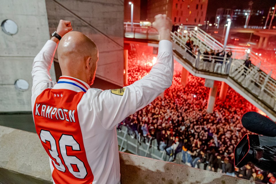 Ten Hag celebrated in front of the Ajax faithful wearing a 'champions' shirt