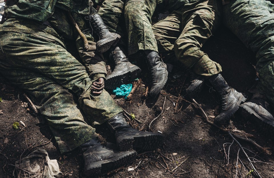 Bodies of dead Russian soldiers piled in a grave in Vilkkhivka, near Kharkiv