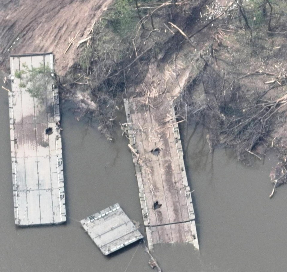 Large shell holes were seen in pontoon bridges floating along the river