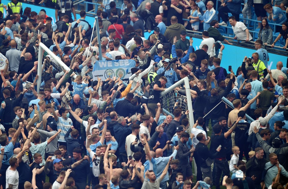 Supporters flooded on to the playing surface at the full-time whistle