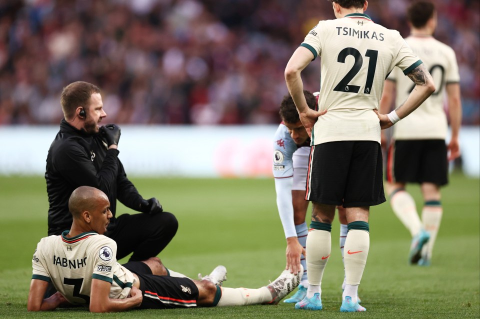 Fabinho appeared to hold his hamstring as he went down